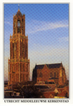 601957 Gezicht op de Domtoren en de Domkerk (Domplein) te Utrecht, in de avondgloed, uit het zuidwesten.